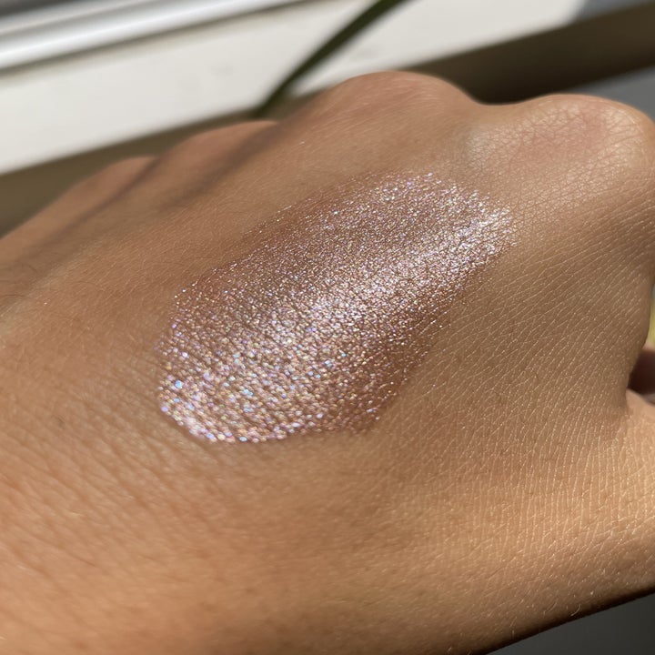 a swatch of the liquid eyeshadow on a caucasian hand