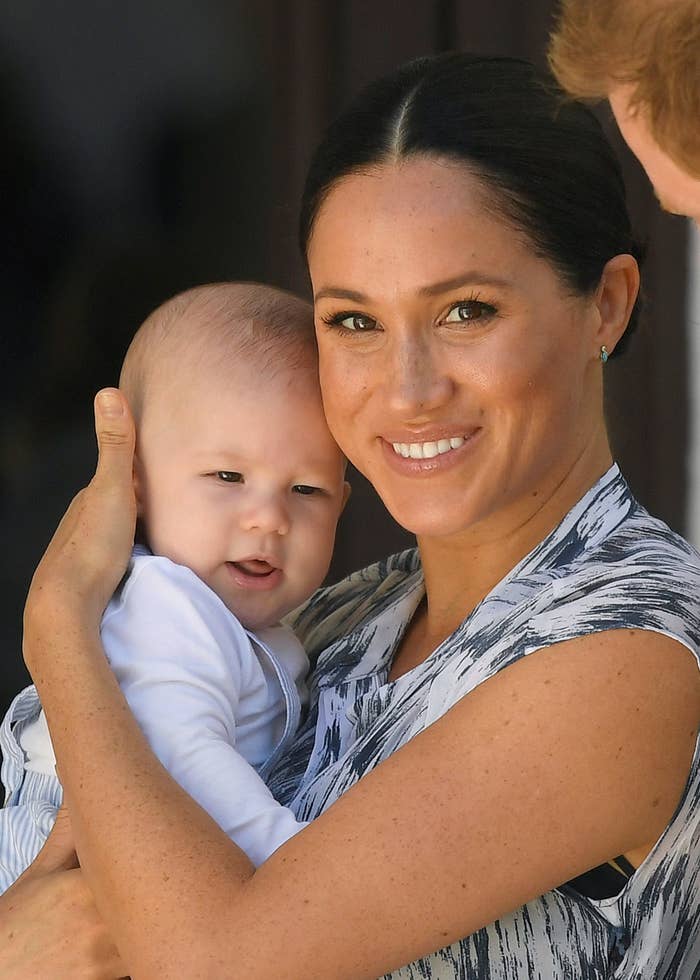 Megan smiling as she holds baby Archie