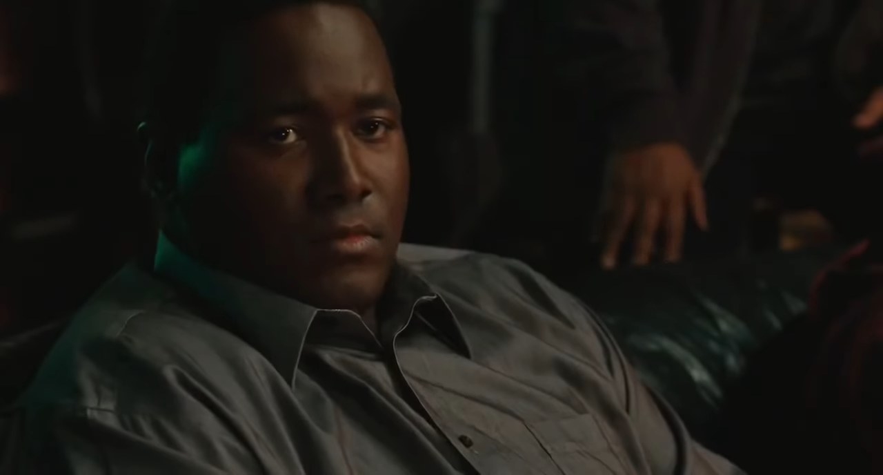 Michael Oher sitting on a couch in &quot;The Blind Side&quot;