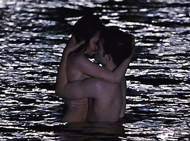 Robert and Kristen kissing