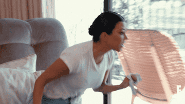 Kourtney Kardashian throws a plastic container at Kim Kardashian in &quot;Keeping Up with the Kardashians&quot;