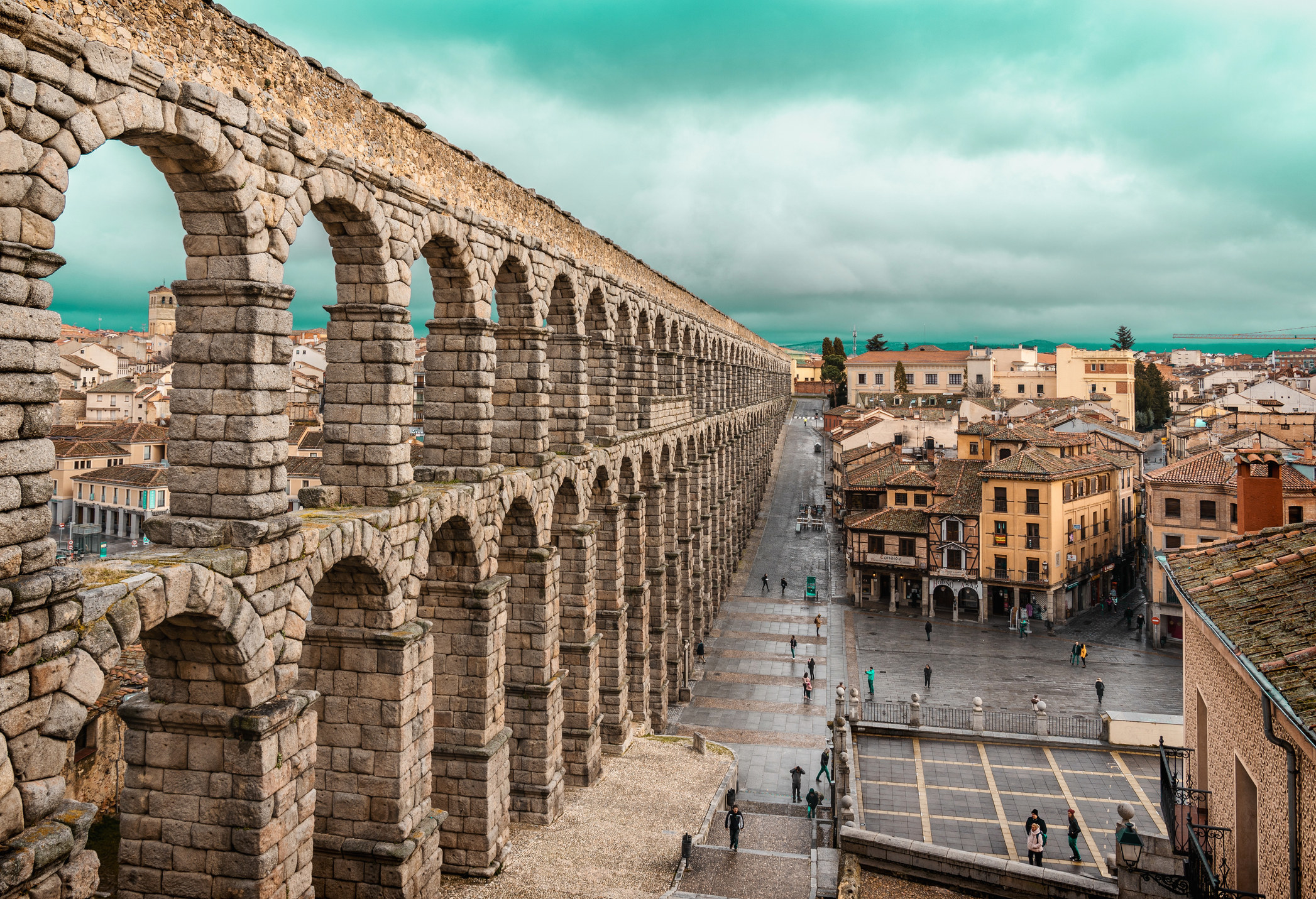 An old aqueduct and the city of Segovia, Spain.