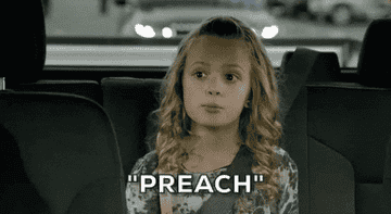 Little girl in a car nodding her head and saying &quot;Preach&quot;
