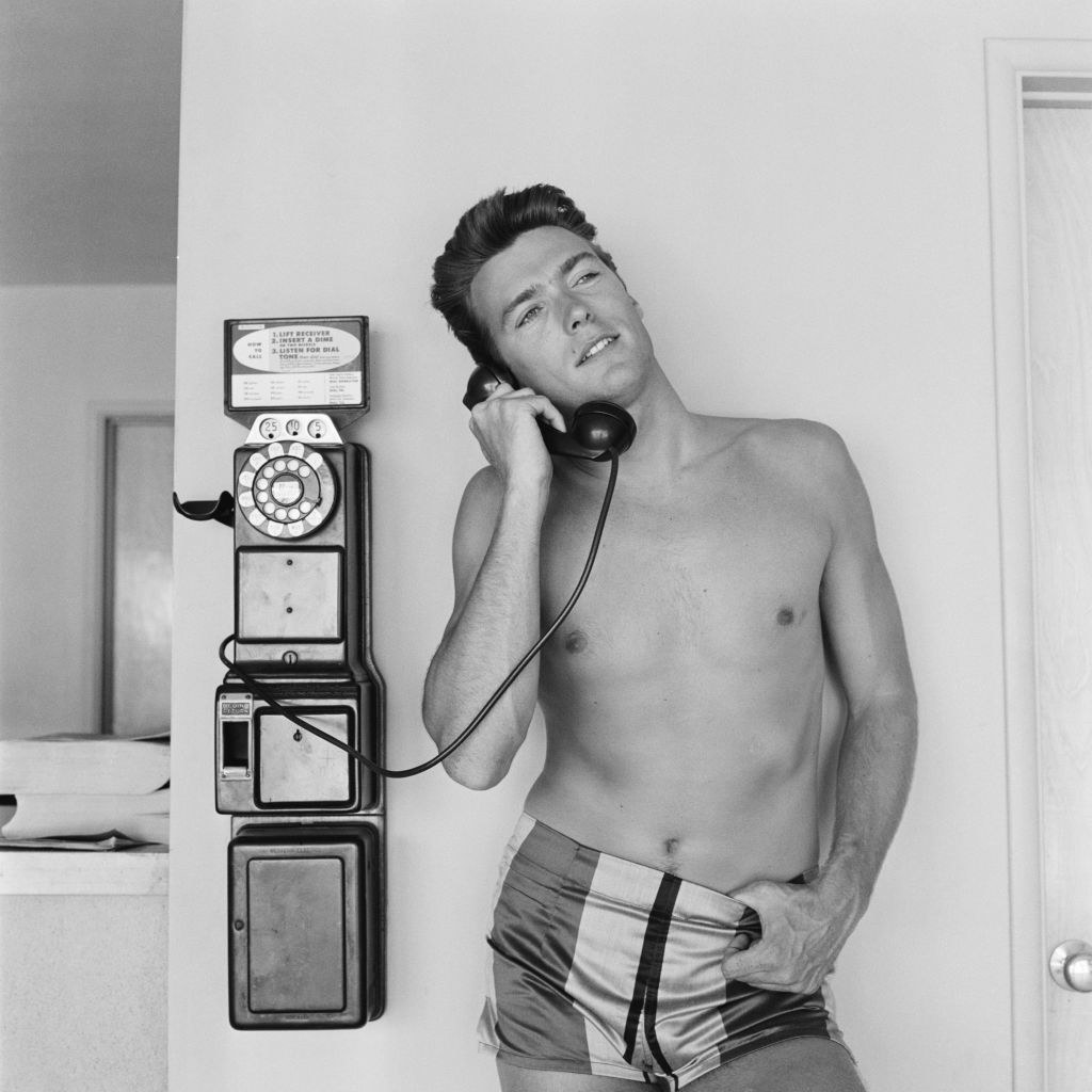 Eastwood talking on a payphone