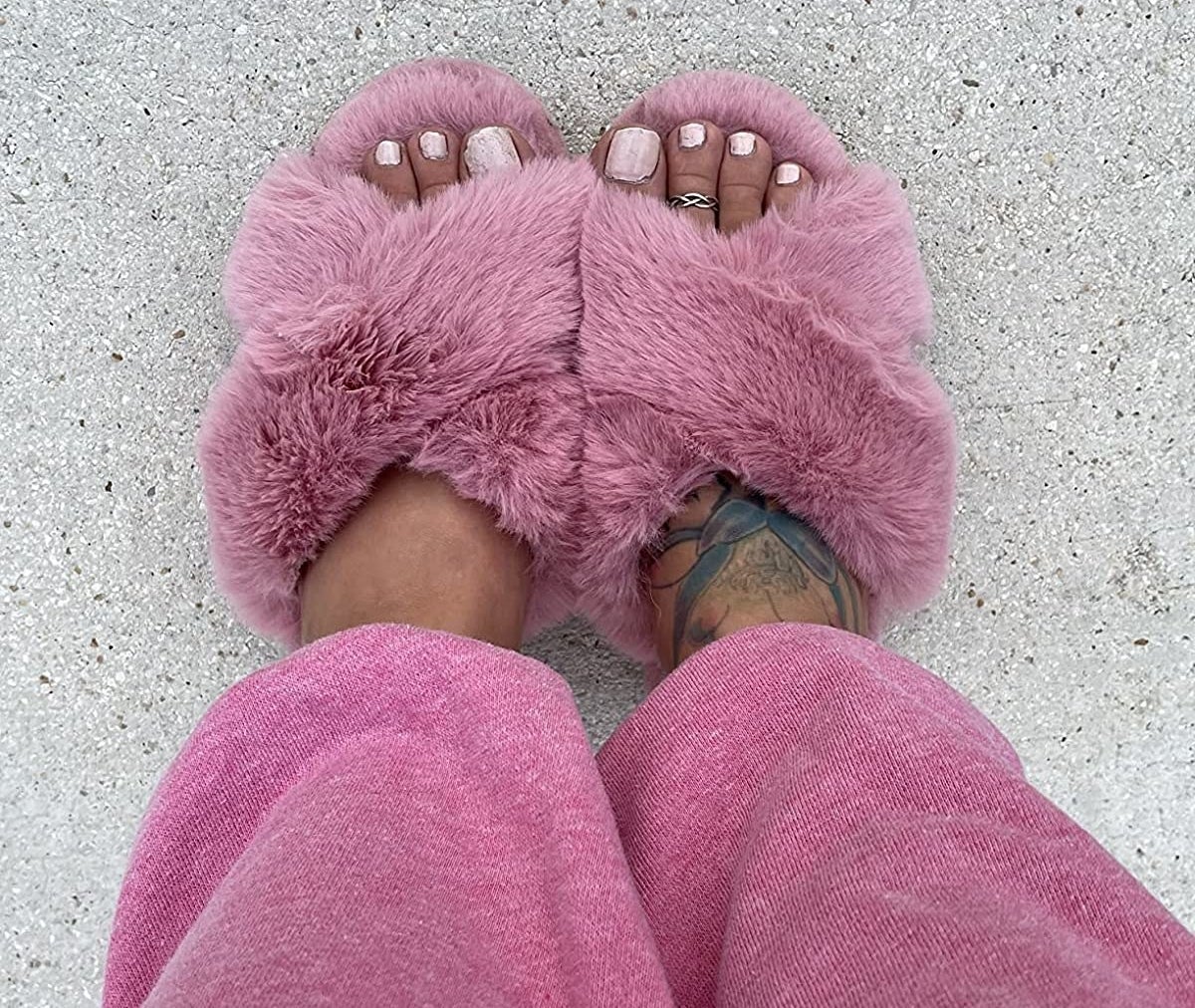 Reviewer wearing pink fluffy slippers
