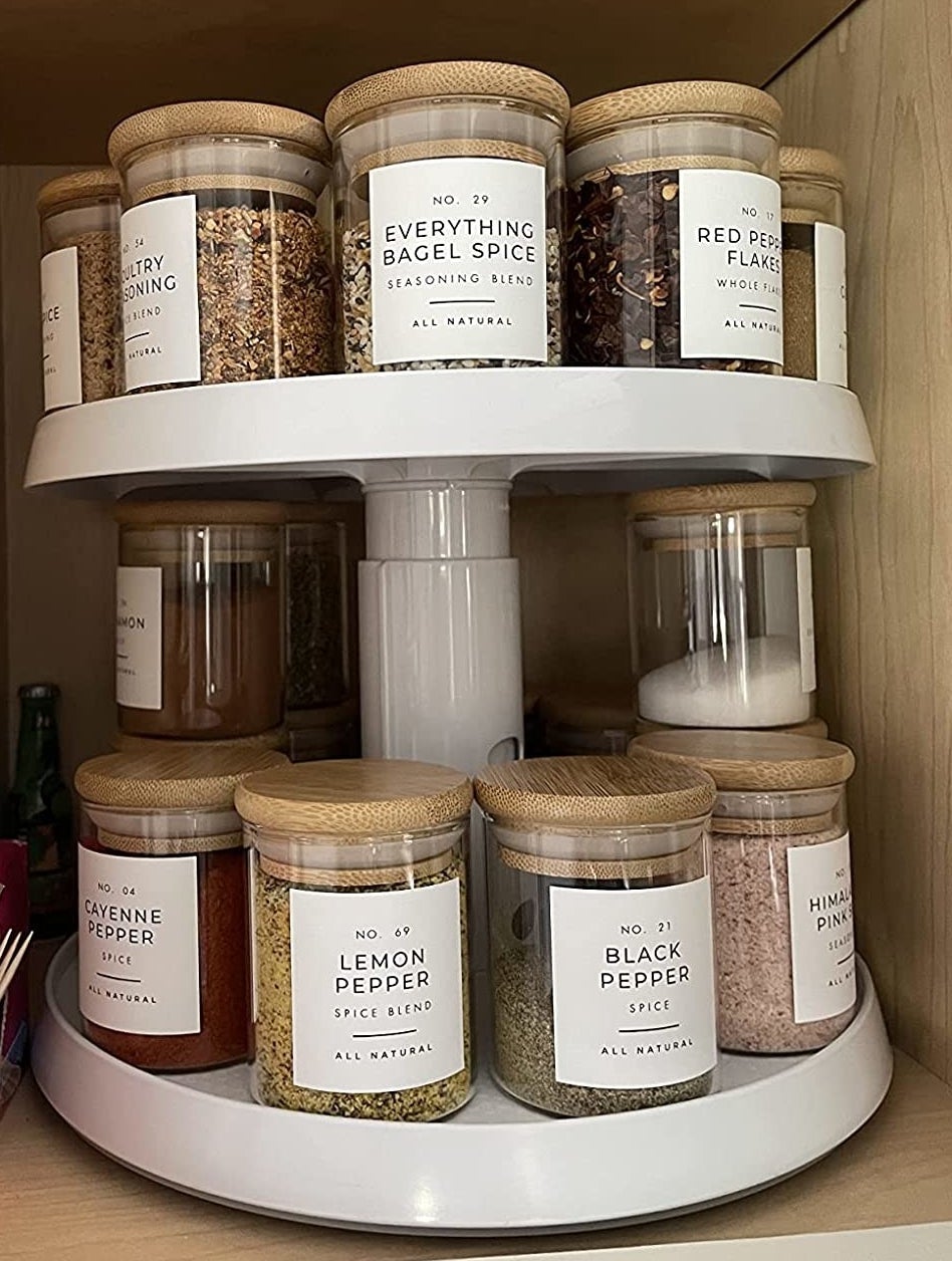 Reviewer image of lazy Susan in cabinet holding spice bottles