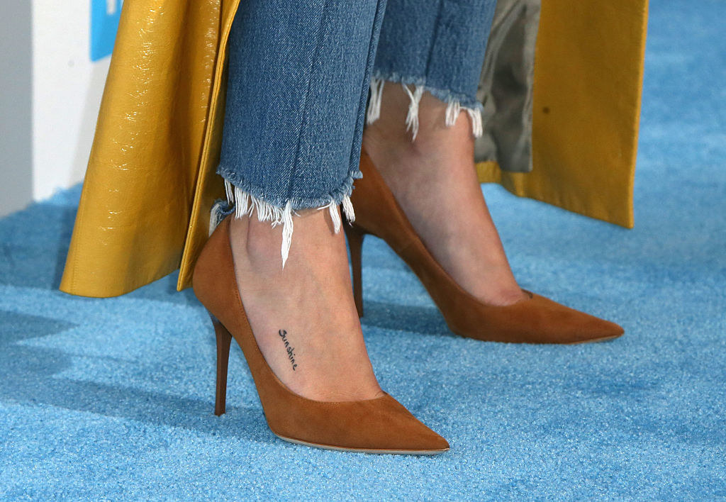 The small tat on the front of her foot on the side