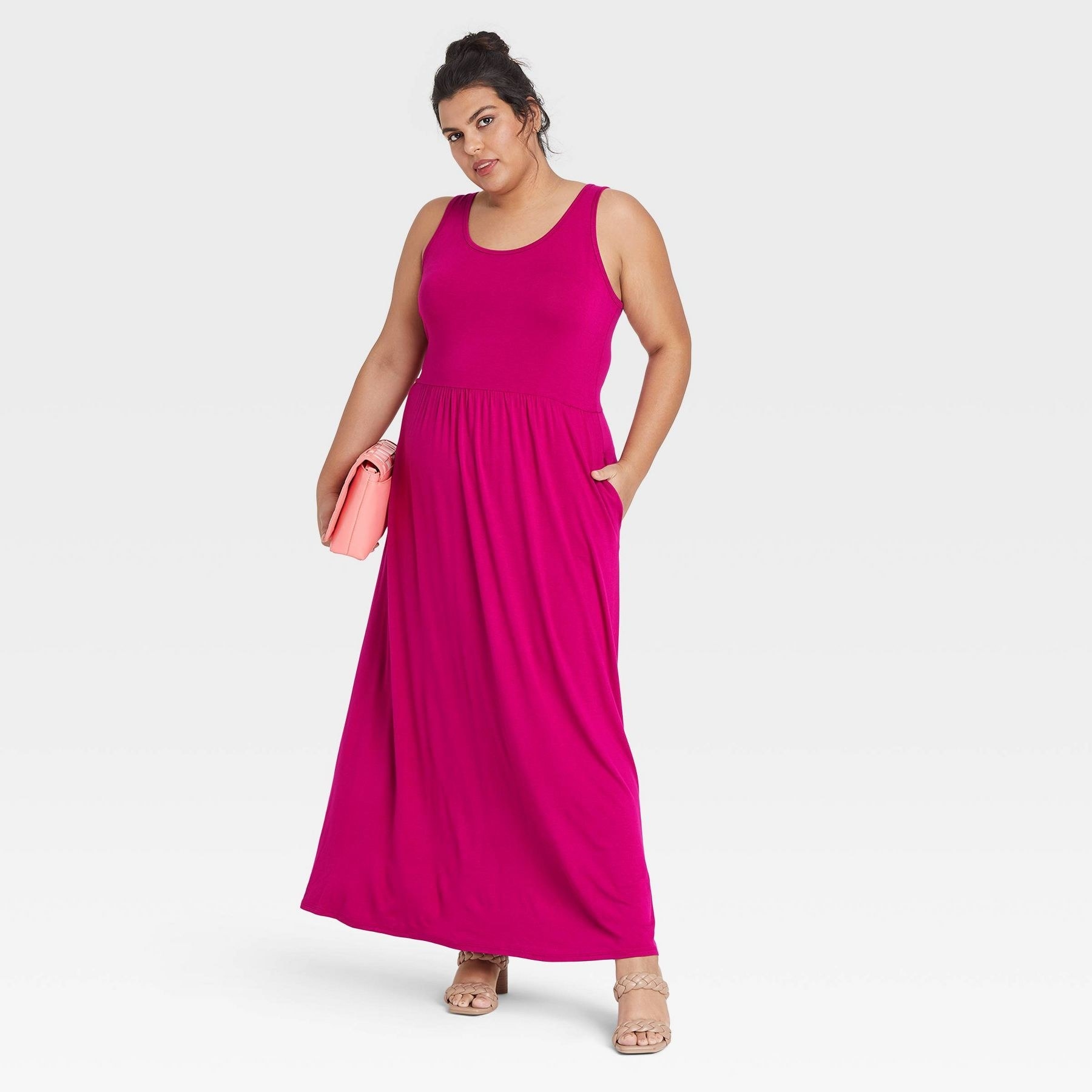 model wearing the dress in pink