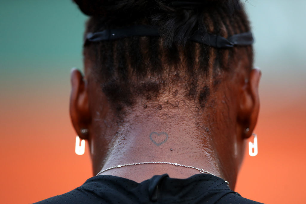 The tat on the back of her neck