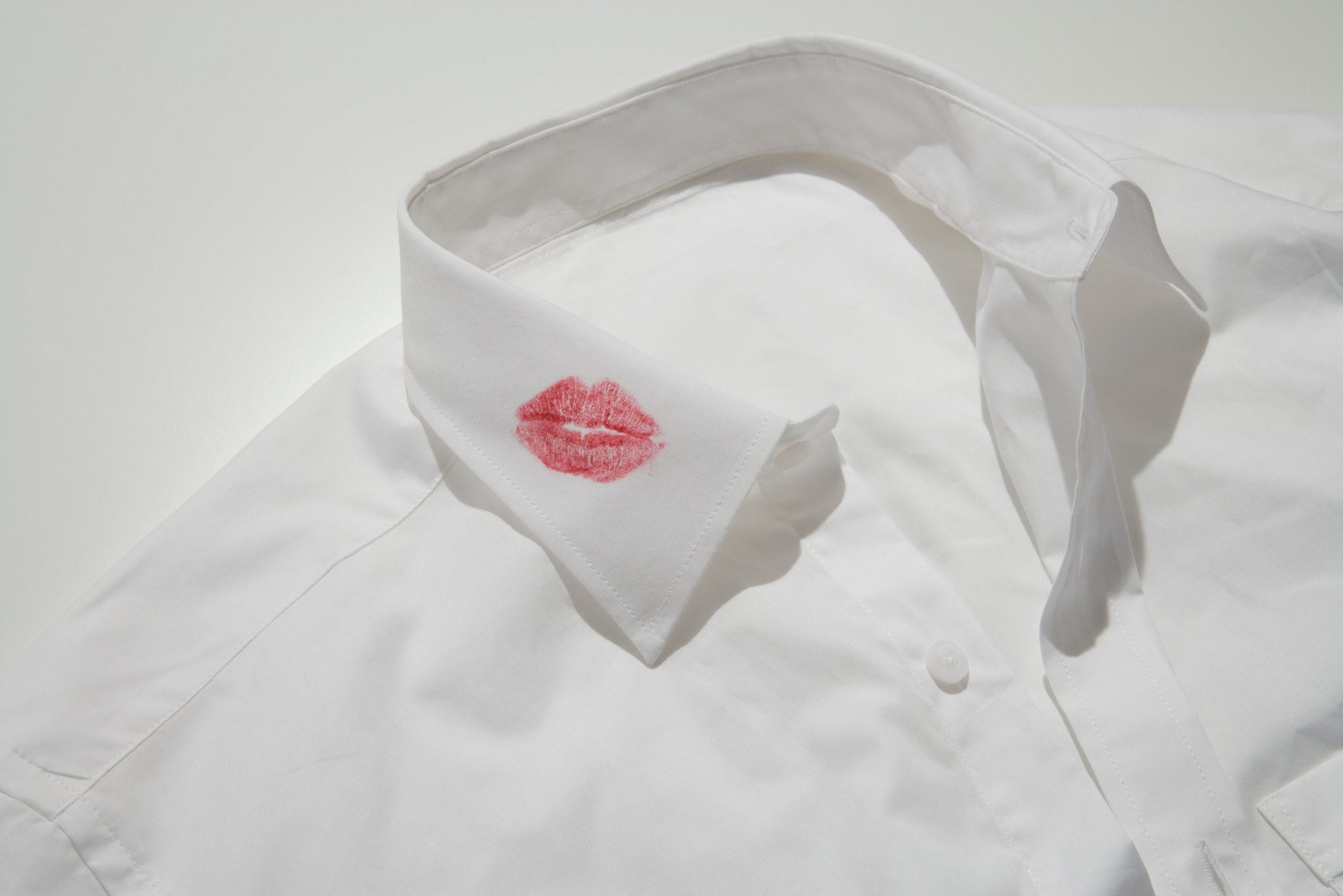 A lipstick kiss on a white shirt