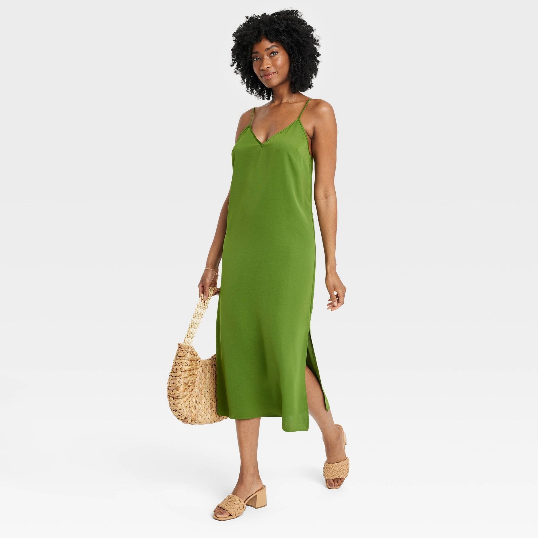 model wearing the dress in green