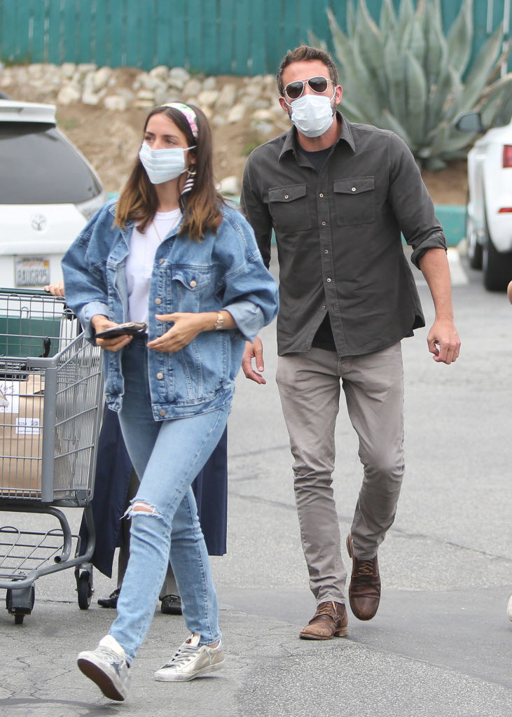 Ben and Ana walking with face masks on