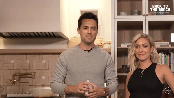 The exes standing in a kitchen