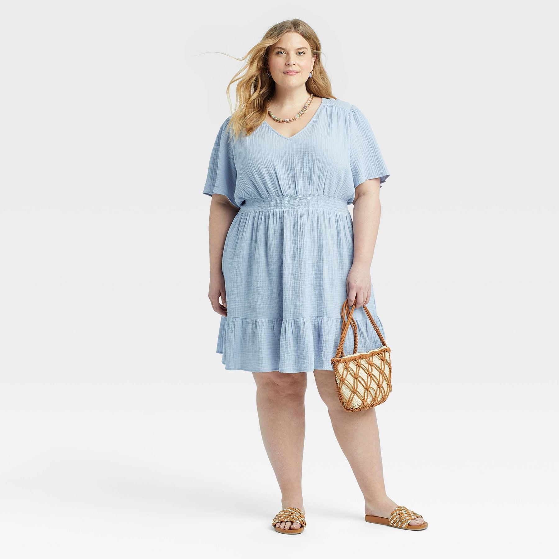 model wearing the dress in light blue