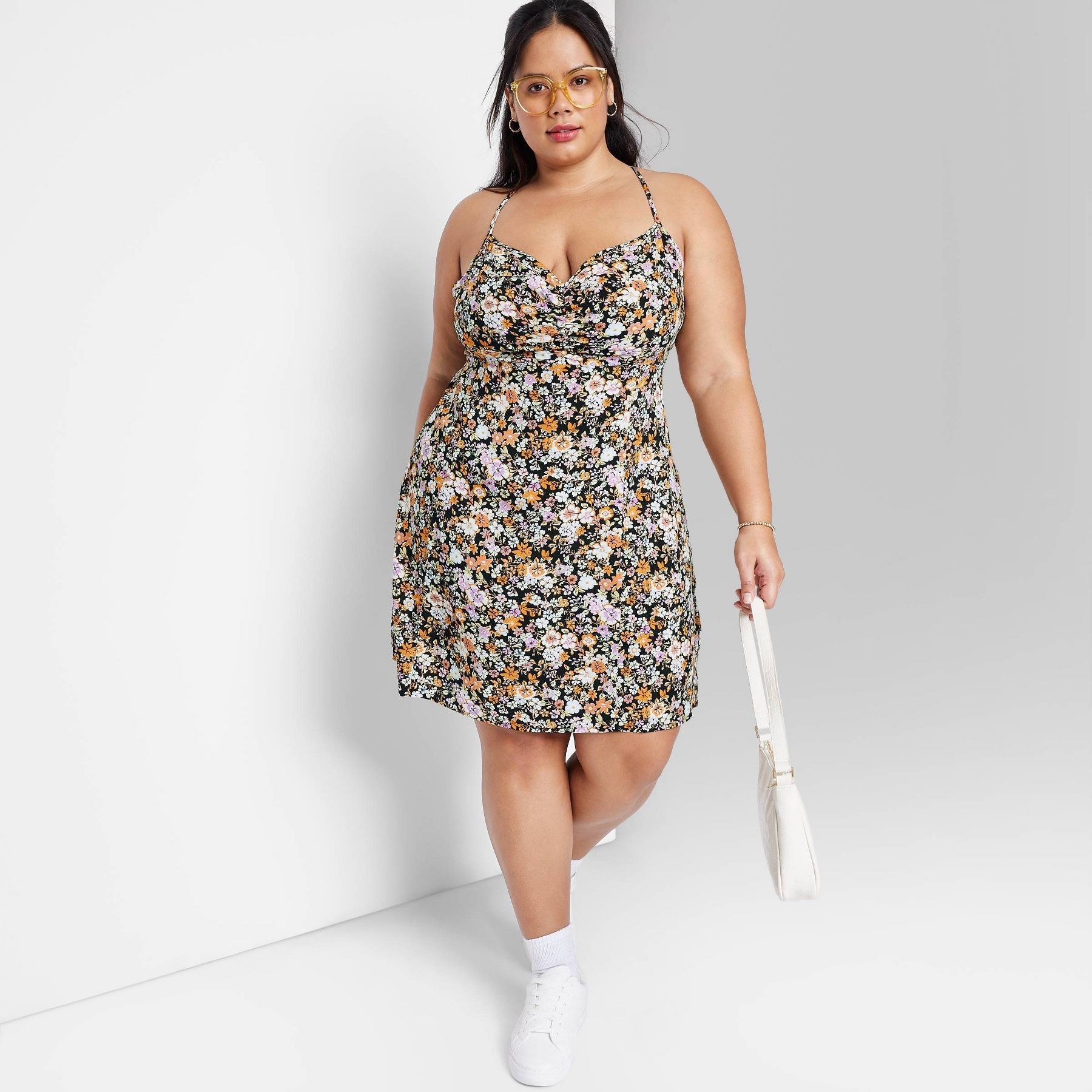 model wearing the dress in a floral pattern