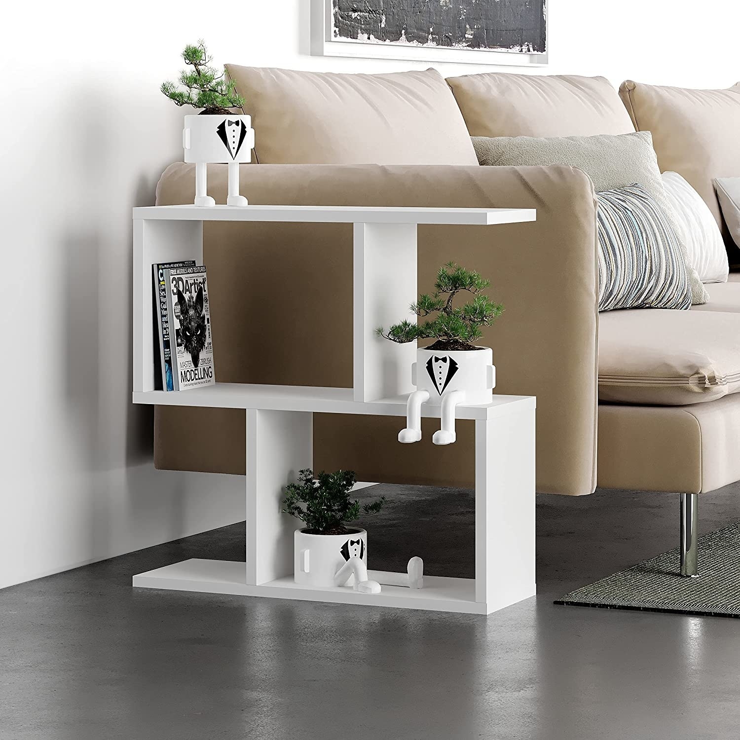 an abstract shelving unit next to a sofa