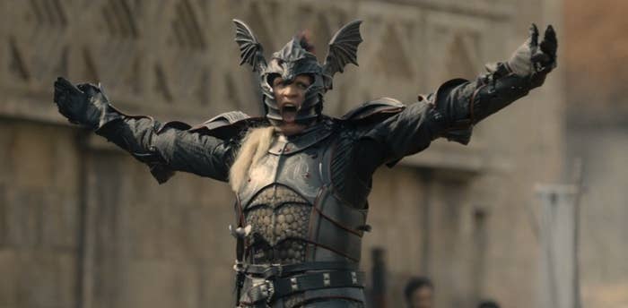 Daemon Targaryen with his arms raised and in full armor