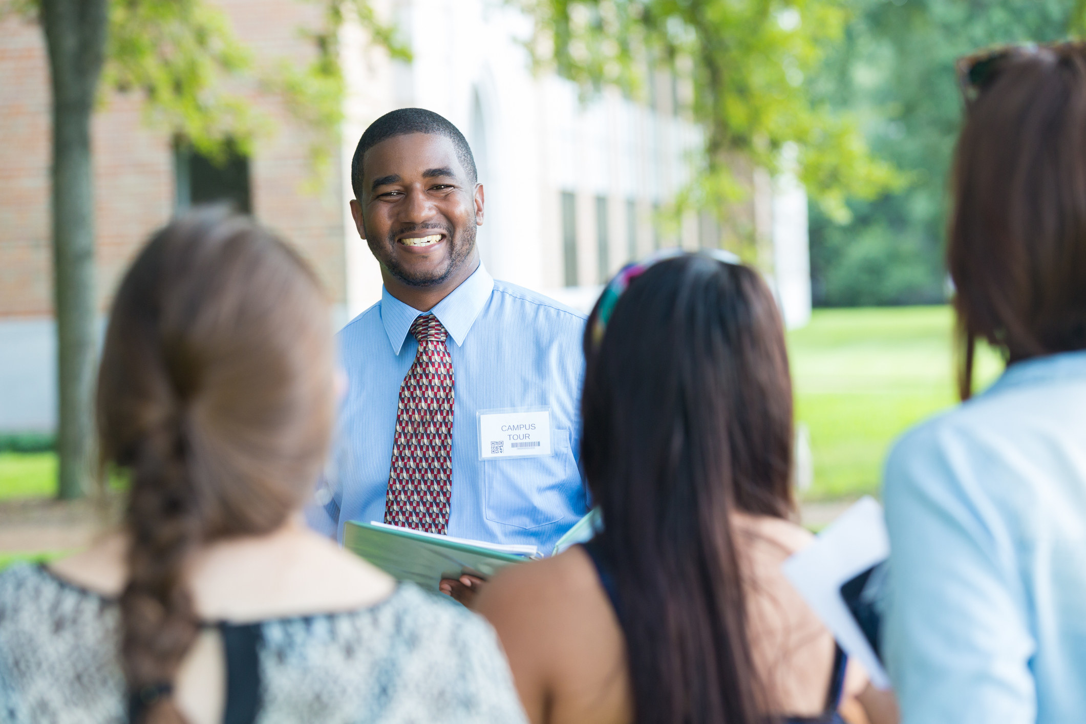 admin giving a tour to students