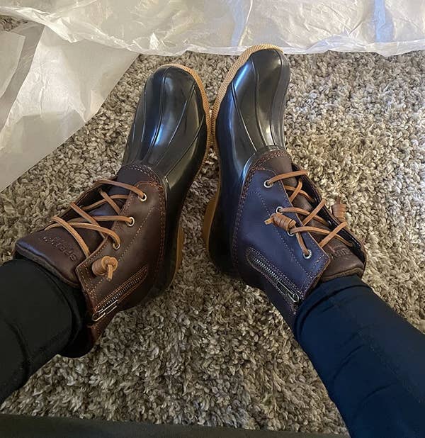 Reviewer wearing black and brown boots