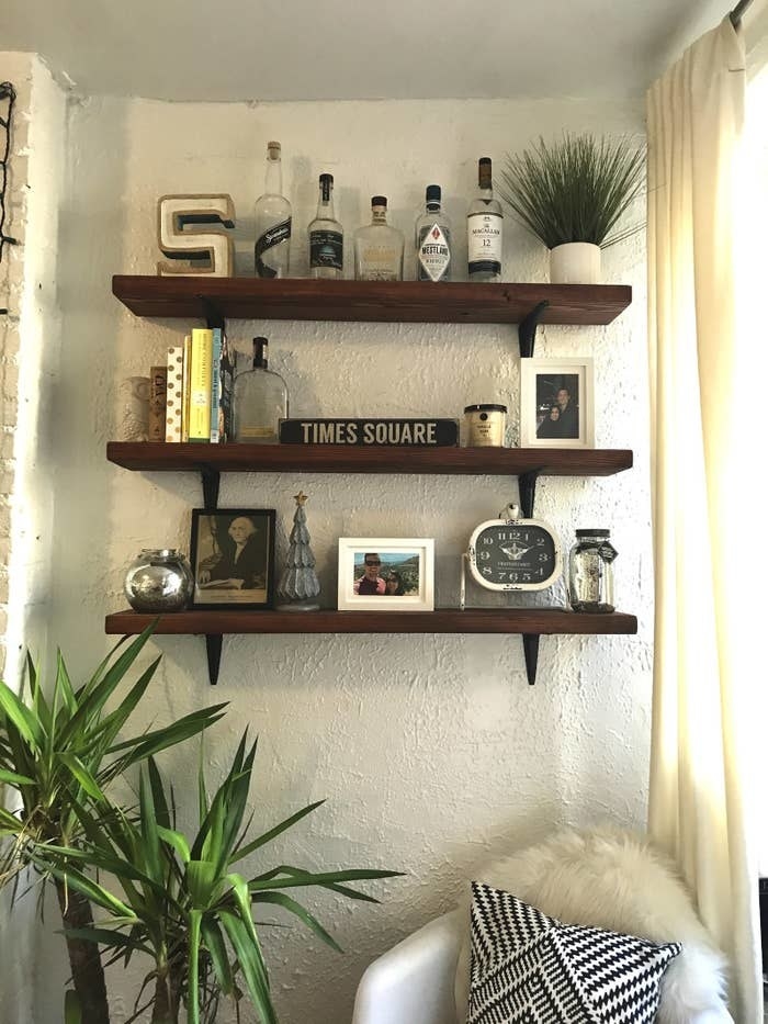 shelves on a wall holding decor