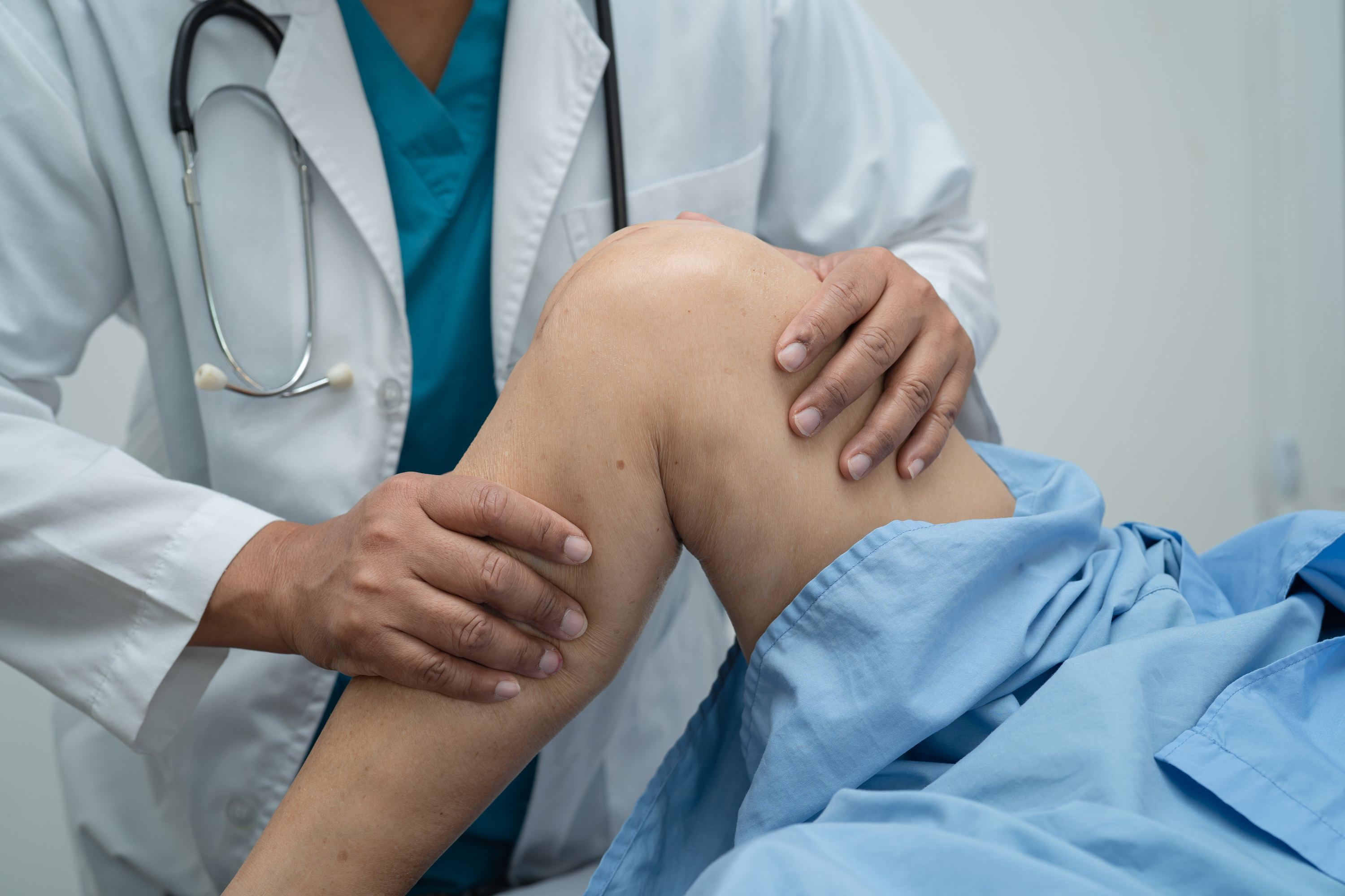 a doctor examining a leg