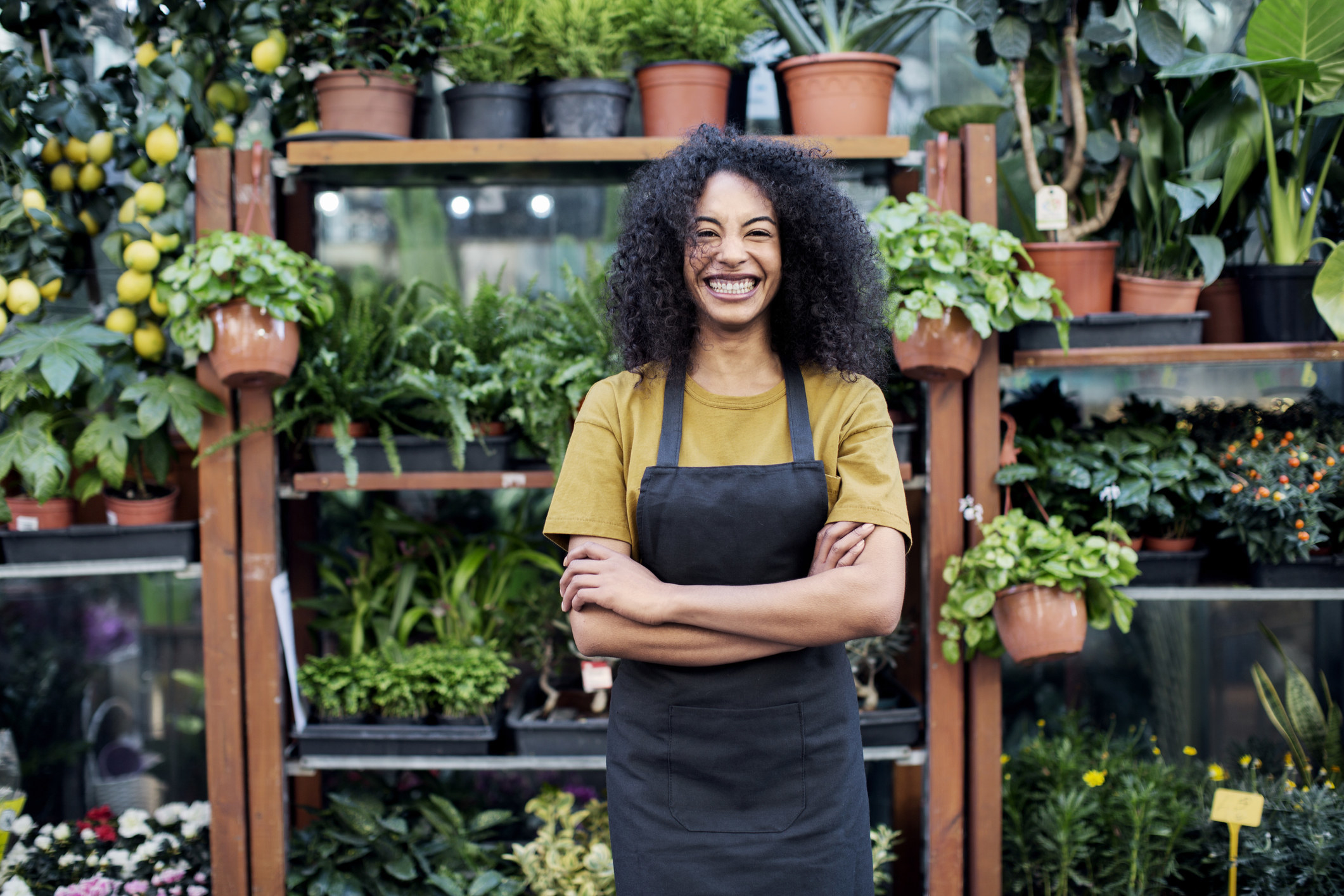 A woman standing amongst plants