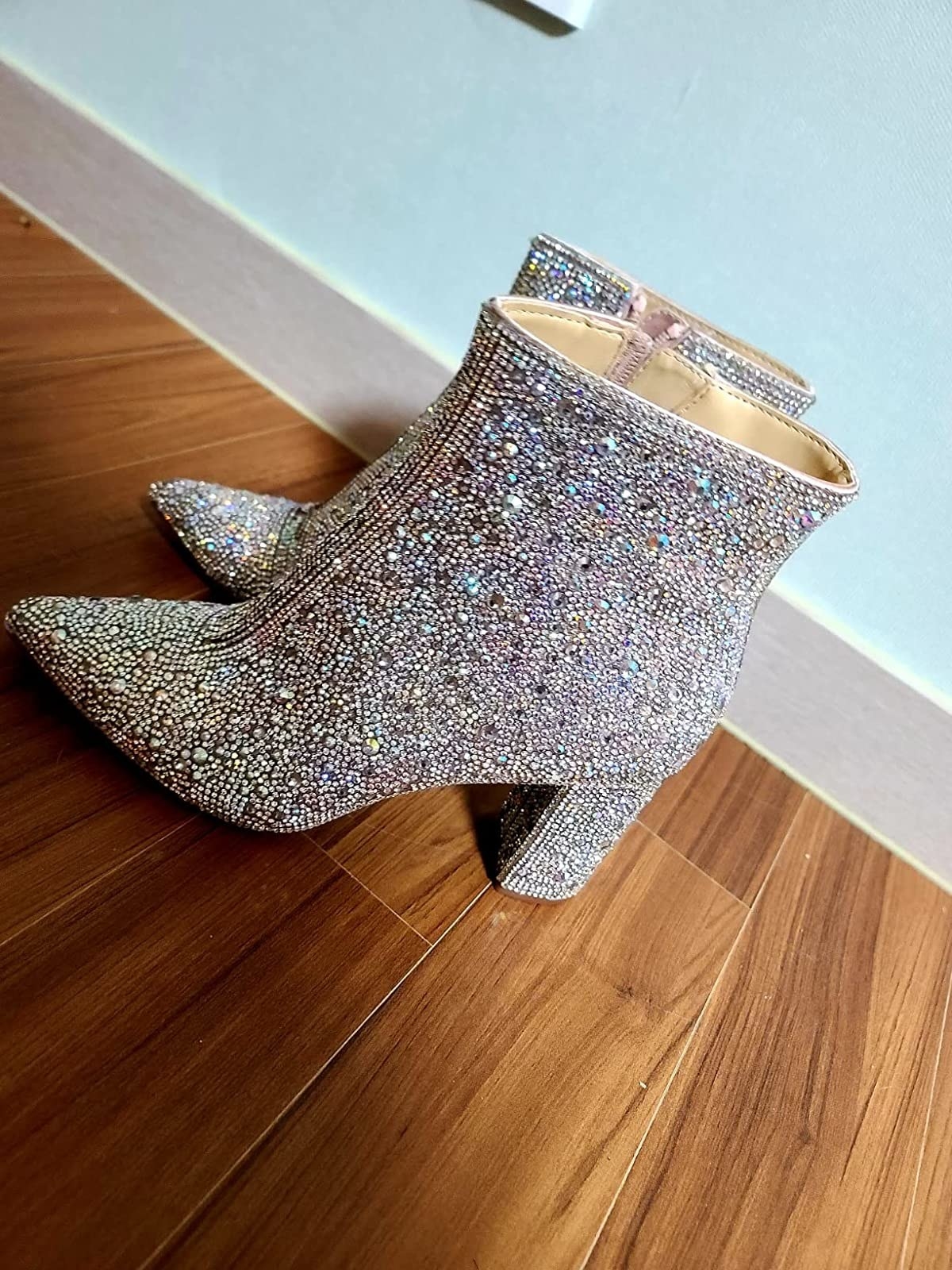 Glittery boots on hardwood floor