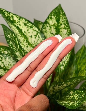 a photo of the sunscreen applied on two fingers