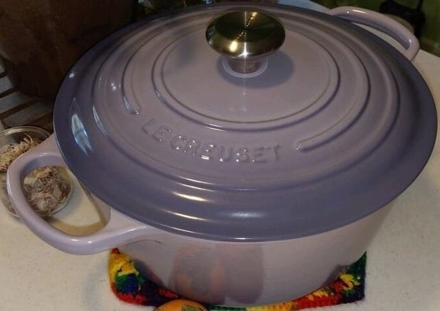 a reviewer photo of the purple le creuset