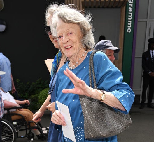 Maggie Smith smiling and walking