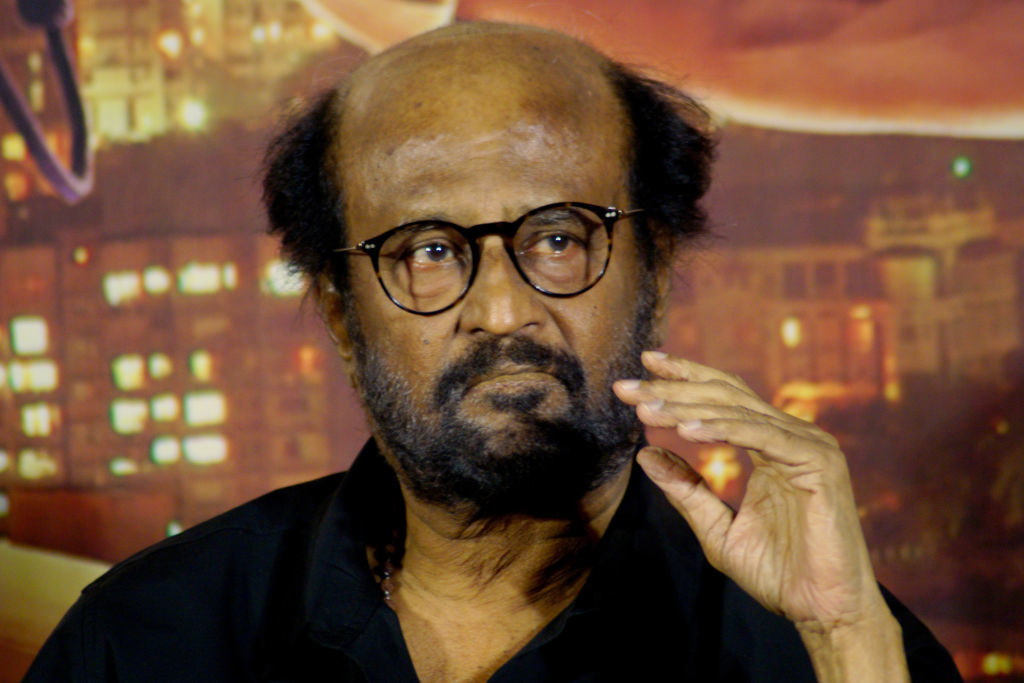 A bespectacled Rajinikanth is photographed
