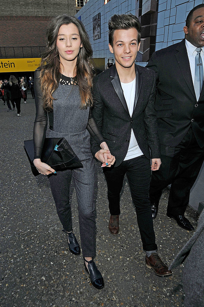 Louis and Eleanor holding hands