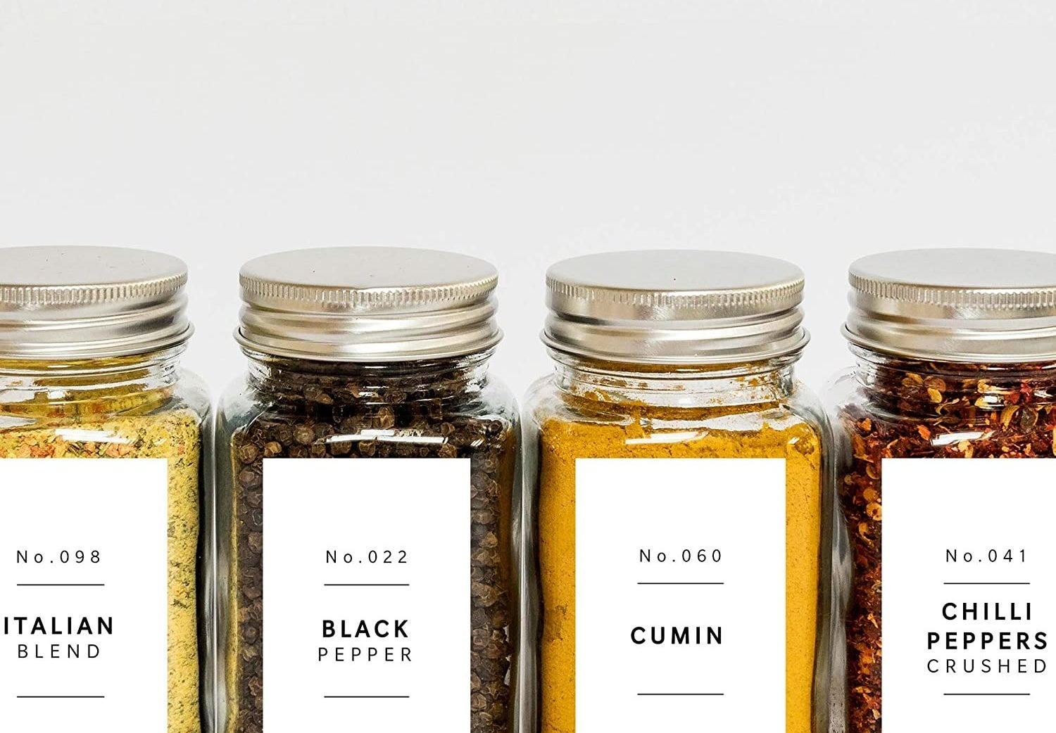 The labels on four jars of spices