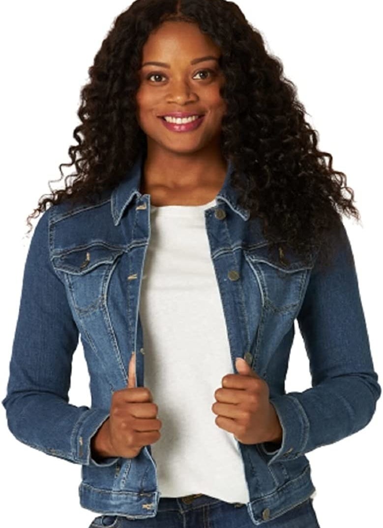 a person wearing the denim jacket with a white t-shirt underneath