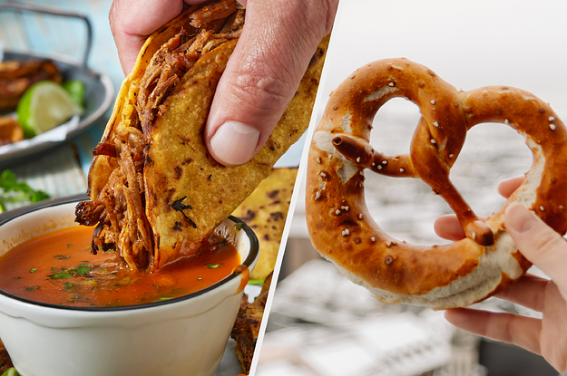 A taco is dipped into a bowl of sauce and a hand holds a soft pretzel