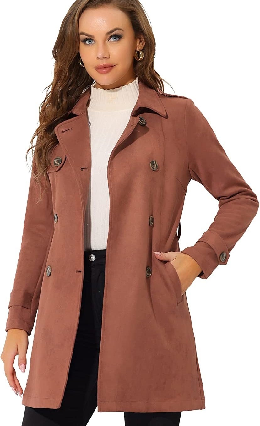 a person wearing a suede-like trench coat