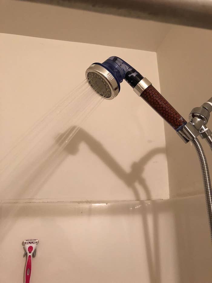 the shower head in a reviewer's shower