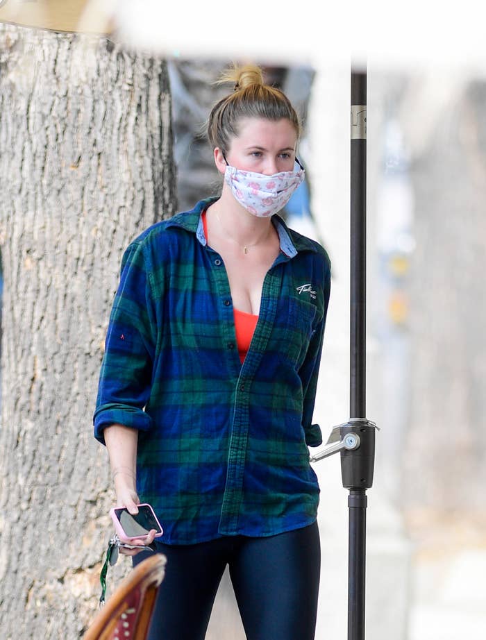 Ireland walking down the street with a face mask