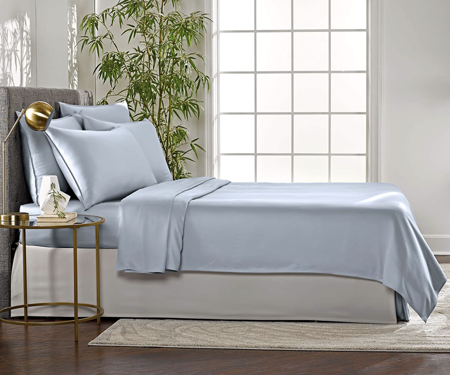 the sheets in light blue on a bed