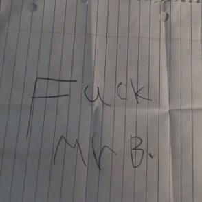 Close-up of handwritten &quot;Fuck Mr B&quot;