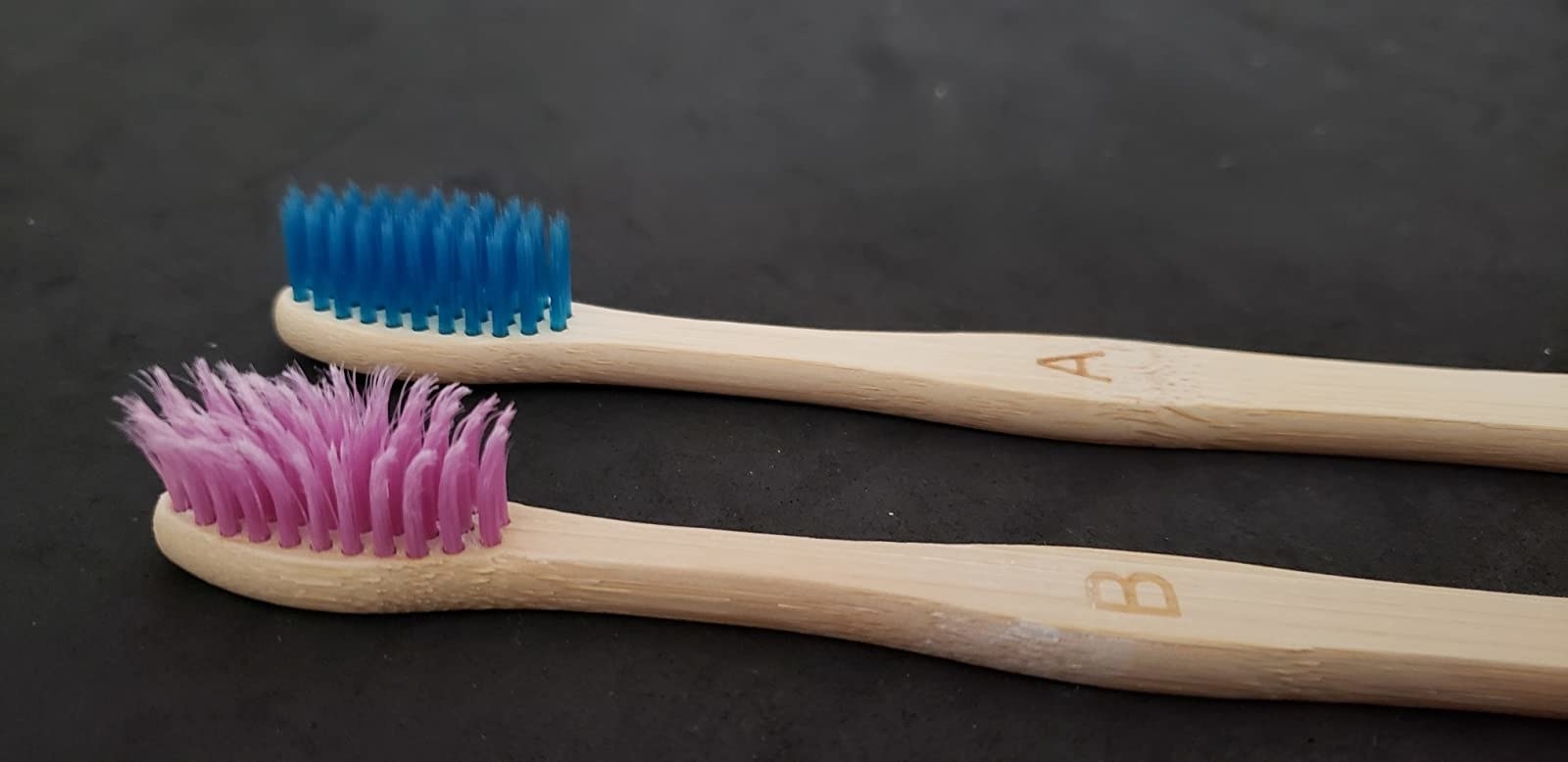 One used toothbrush one new