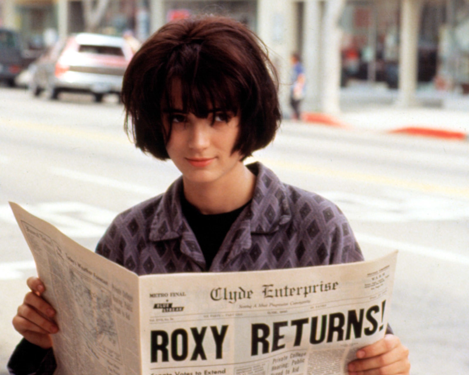 close up of winona&#x27;s character reading a newspaper