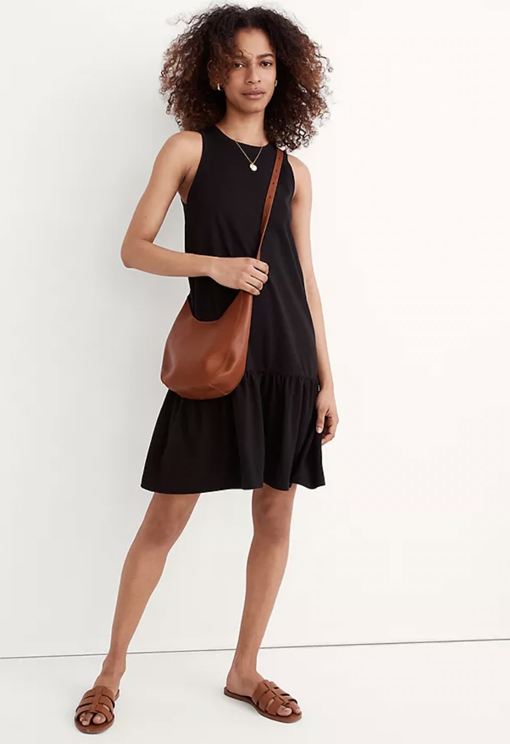 a model wearing the bag in brown