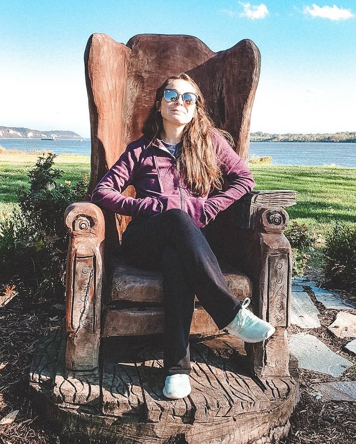 Daniella sitting on a throne statue in Grafton, MO