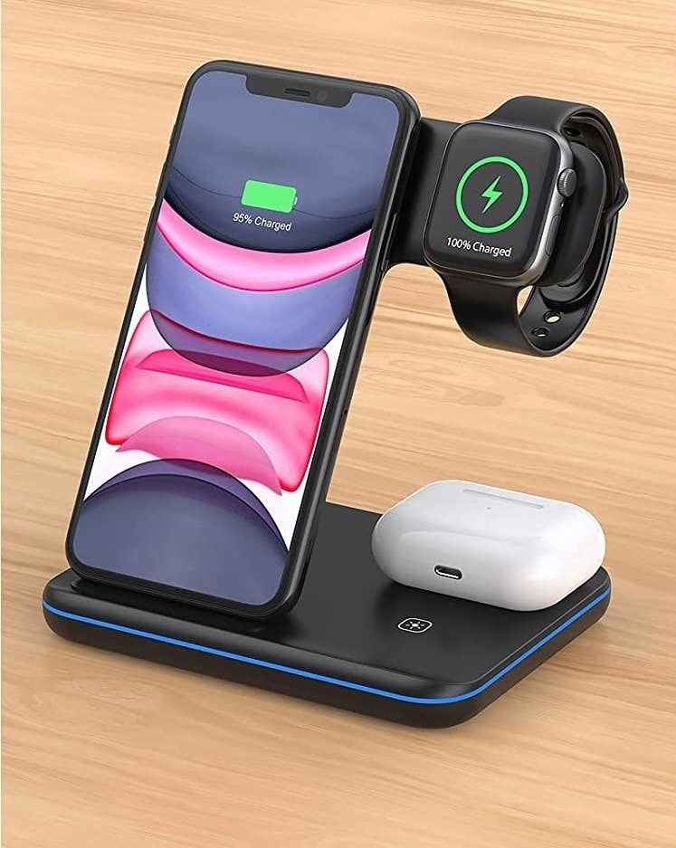 a charging station holding a phone, watch, and earbuds
