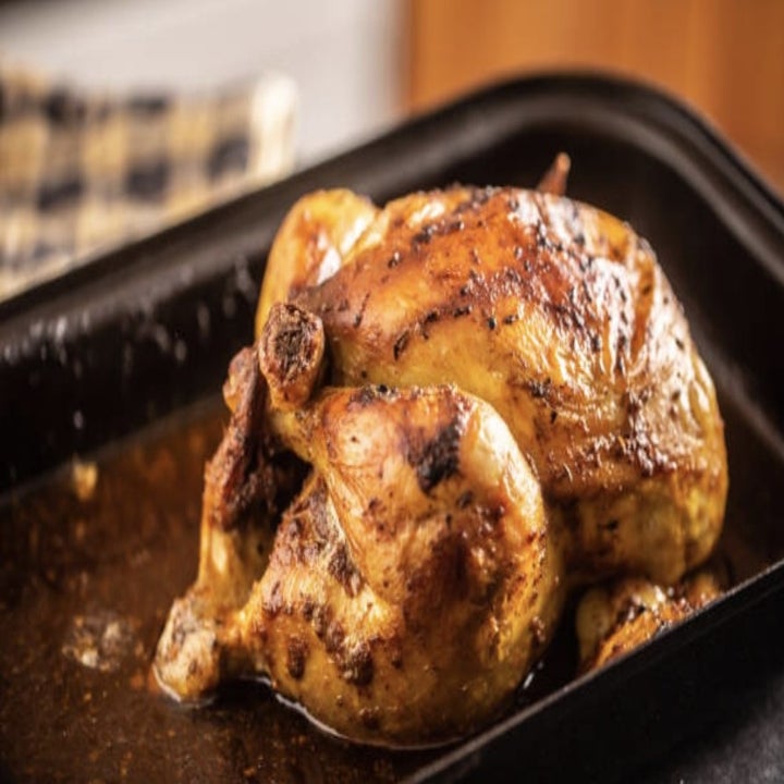 a roasted chicken in a pan