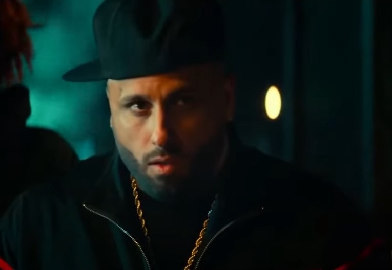Nicky Jam as  Lorenzo Zway Lo Rodríguez looking nervous about something
