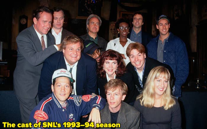 Lorne Michaels with the cast of SNL&#x27;s 1993–94 season, including Phil Hartman, Mike Myers, Chris Farley, Dana Carvey, and Ellen Cleghorne