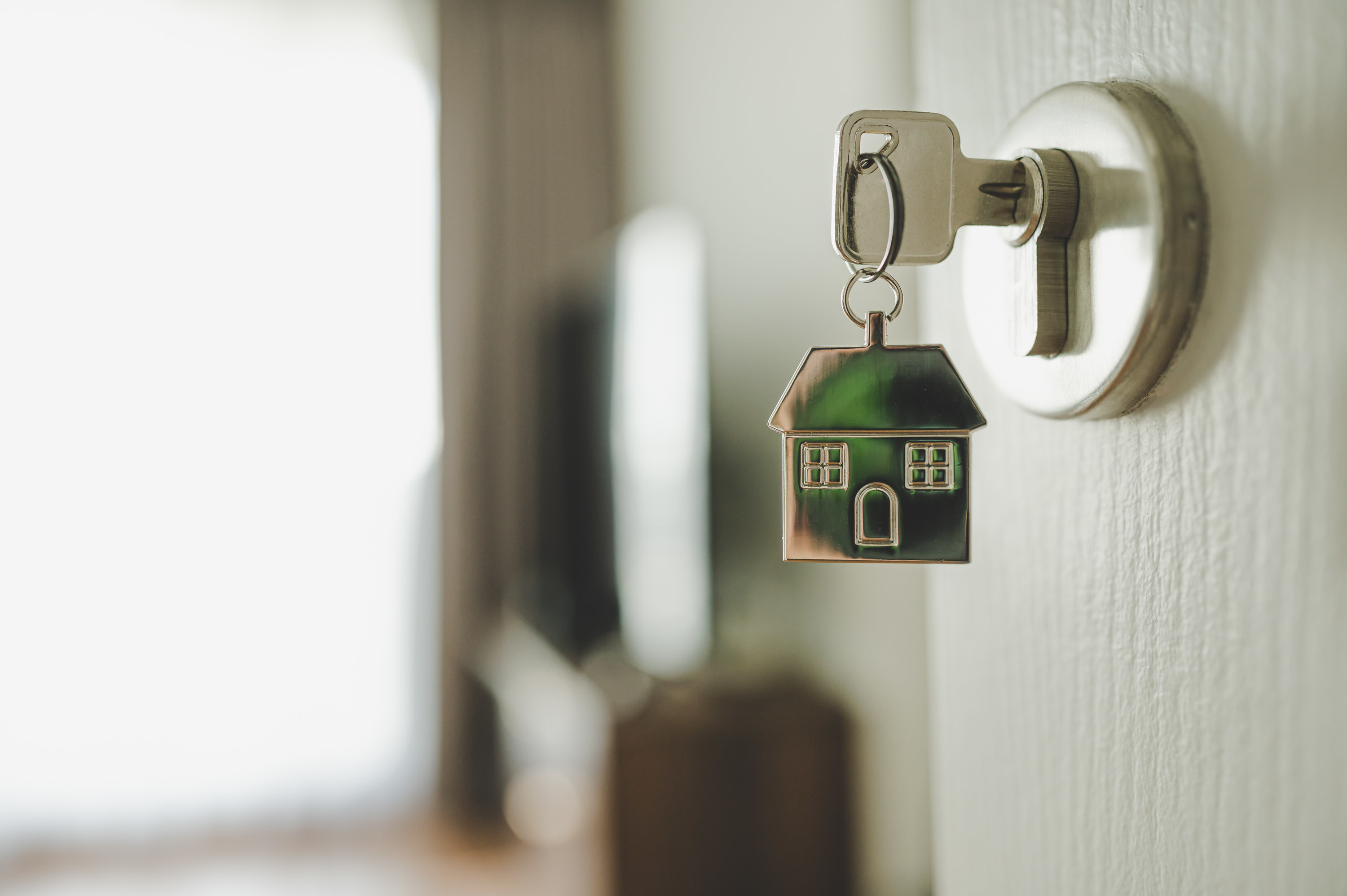 house key with a house-shaped keychain