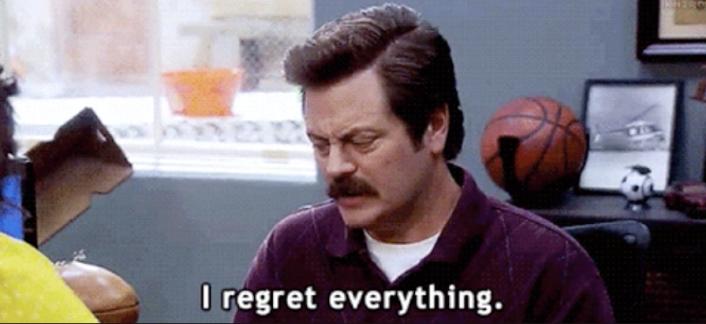 Ron Swanson with his eyes closed with the words &quot;I regret everything&quot;